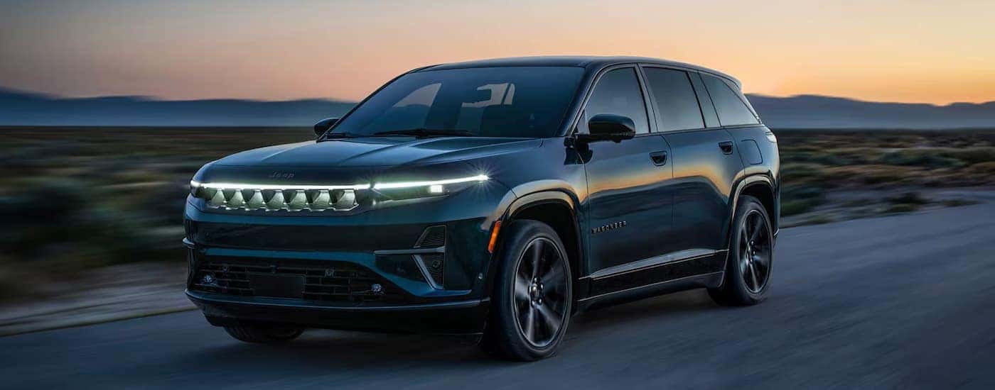 A black 2025 Jeep Wagoneer S driving off-road