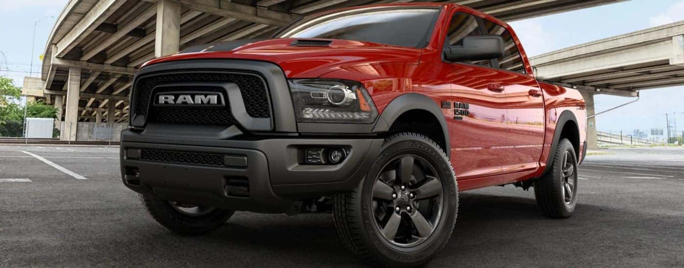 Red 2019 Ram 1500 Classic parked underneath a bridge.
