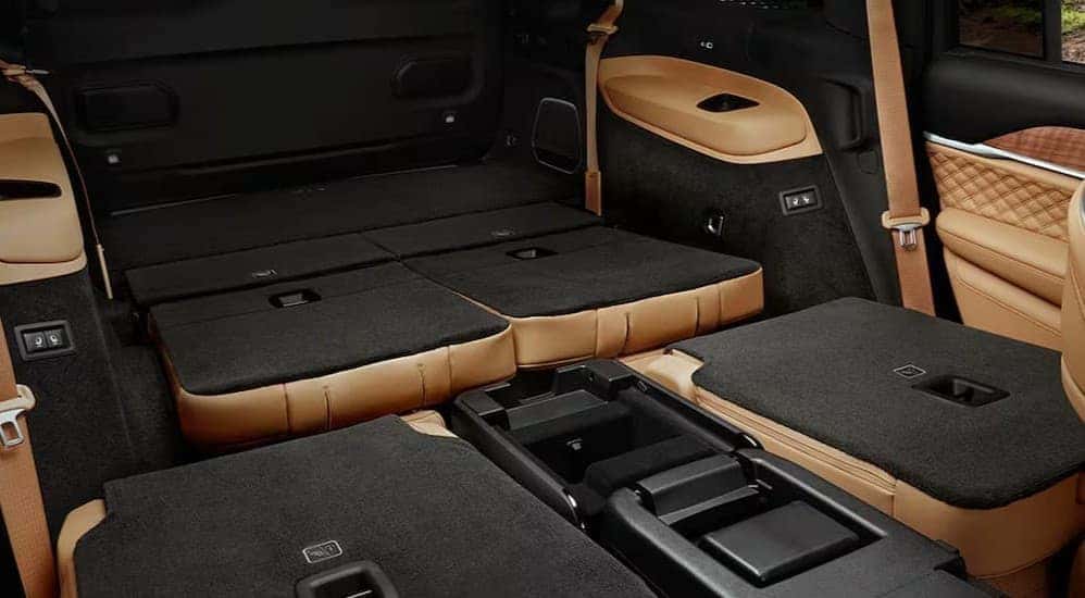 The black and tan rear cargo area in a 2025 Jeep Grand Cherokee L.