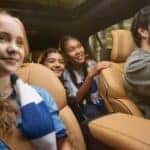 Several people driving in a 2025 Jeep Grand Cherokee L.