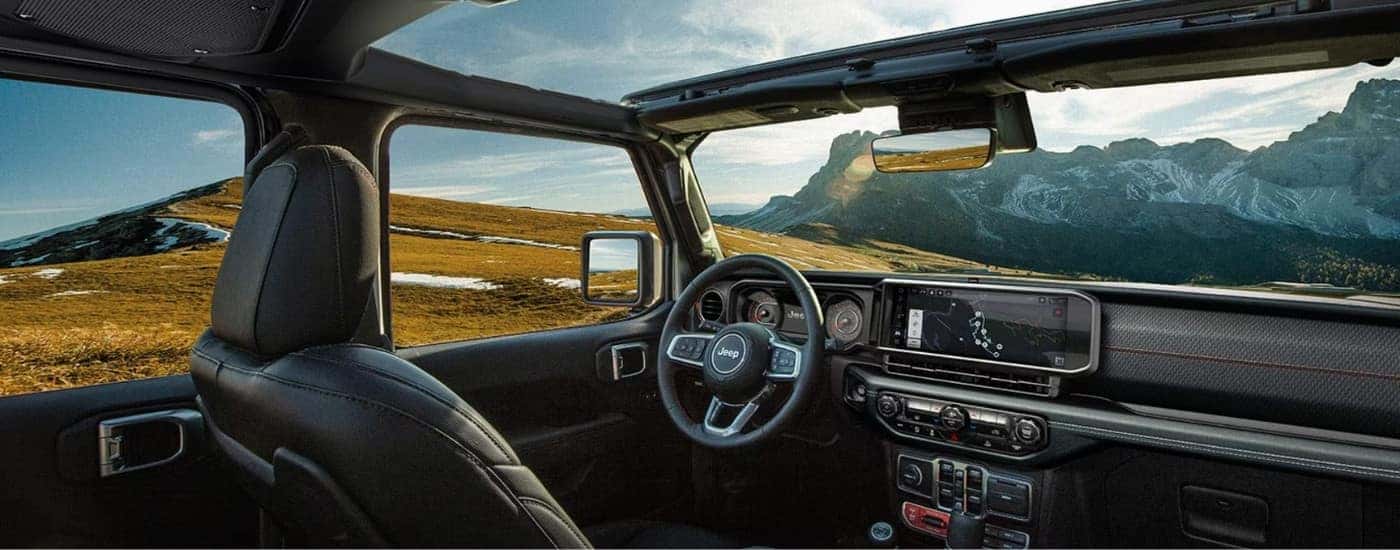 The black interior of a 2025 Jeep Wrangler.