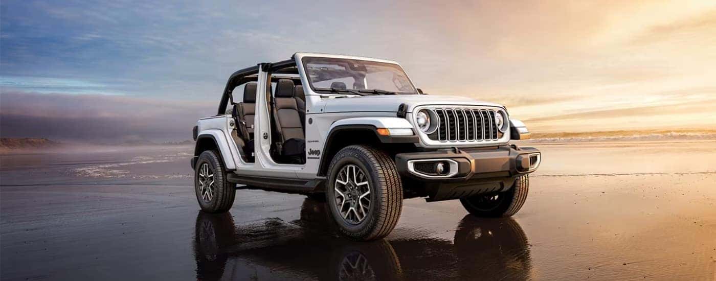 A white 2025 Jeep Wrangler from the side after leaving a Colorado Springs Jeep Wrangler dealer.