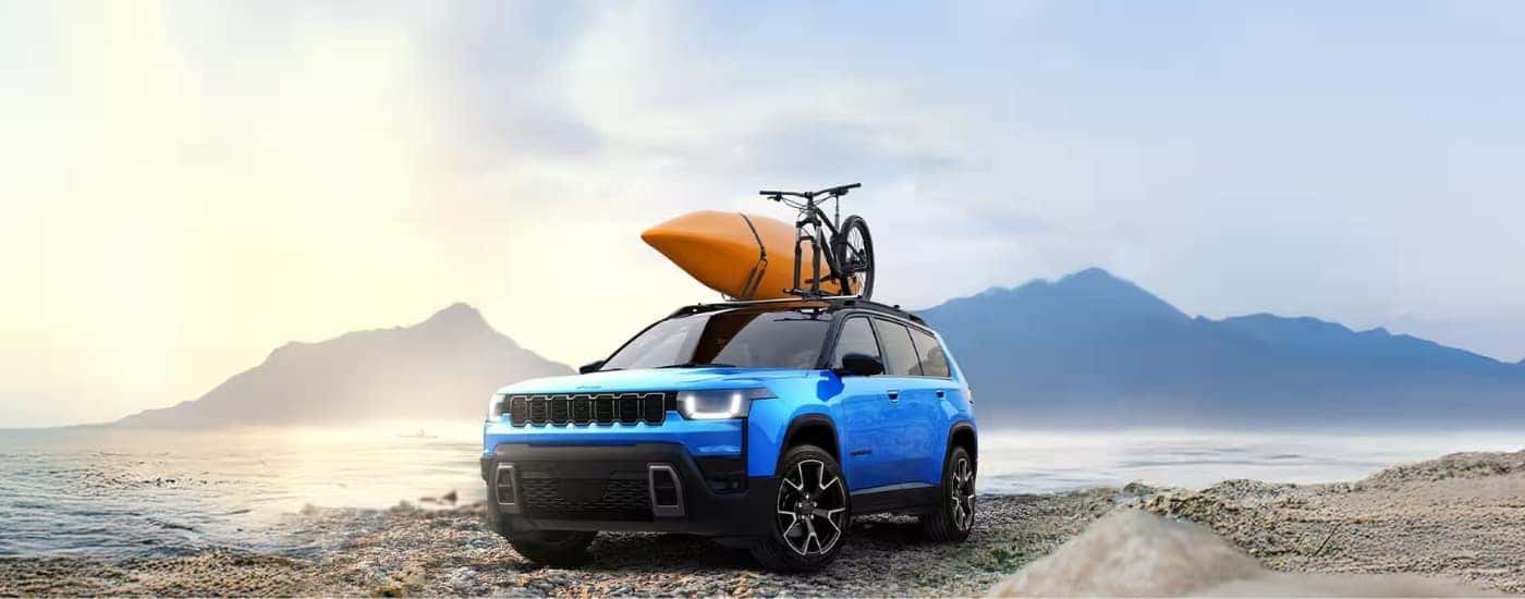 A blue 2026 Jeep Cherokee from the front.