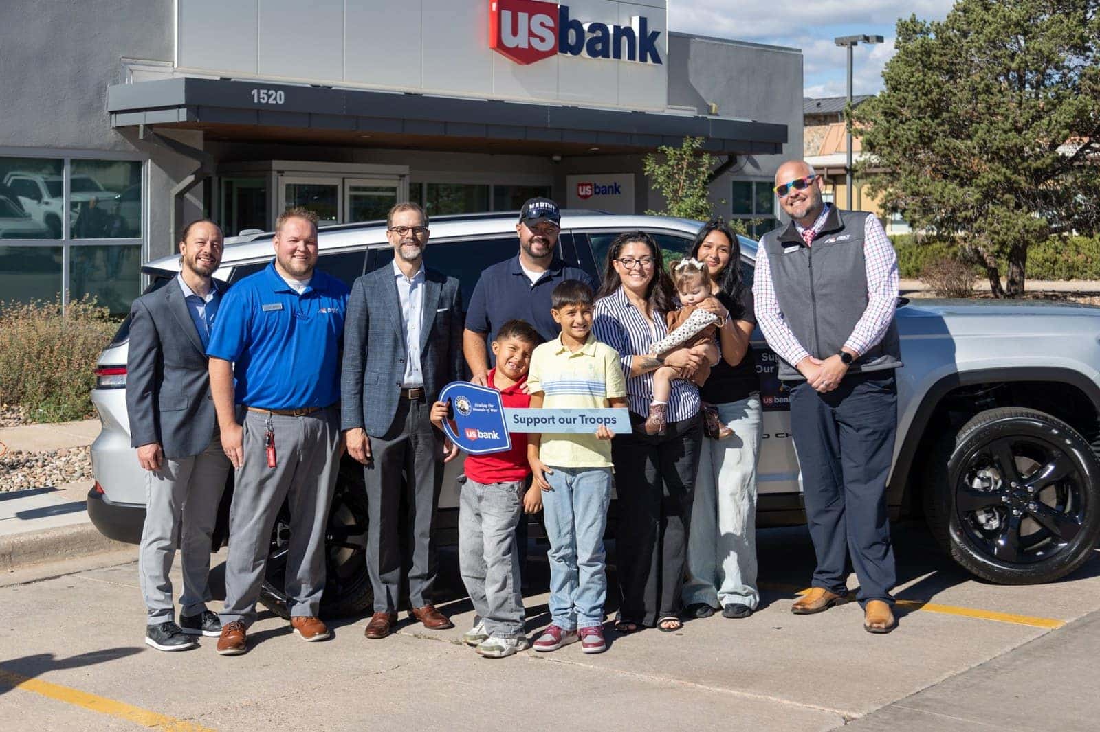 Marine Corps veteran Dustin Gabehart and his family receive a payment-free vehicle from Freedom Alliance and US Bank in Colorado Springs