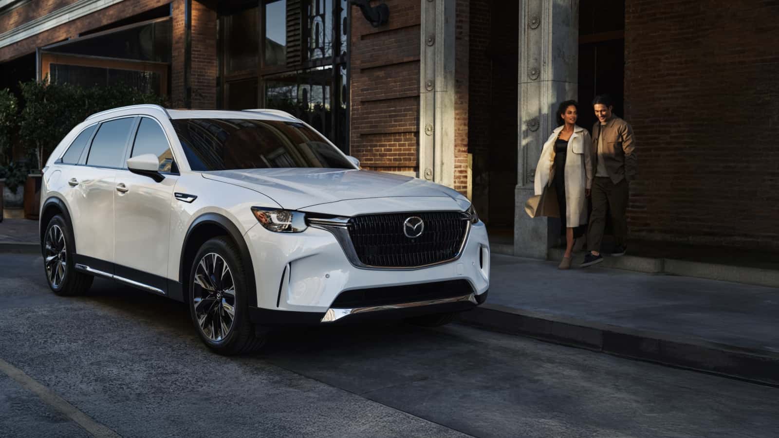 2026-mazda-cx-90-ext-parked-city-couple