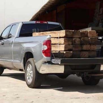 2017 Toyota Tundra bed loaded with wood