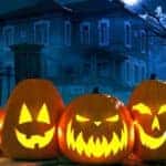 Spooky Haunted House with Carved Lighted Pumpkins