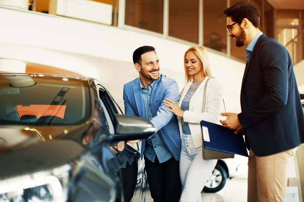 Looking at Car at Dealership